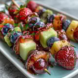 Bright and refreshing Rainbow Fruit Skewers with Honey Dip: a medley of fresh, seasonal fruits served with luscious honey-sweetened yogurt.