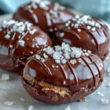 Homemade peanut butter Easter eggs coated in rich dark chocolate and topped with flaky sea salt, perfect for holiday gifting or spring gatherings.
