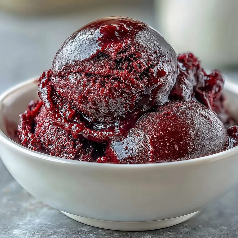 Refreshing black currant sorbet made from fresh berries, perfect for hot summer days.